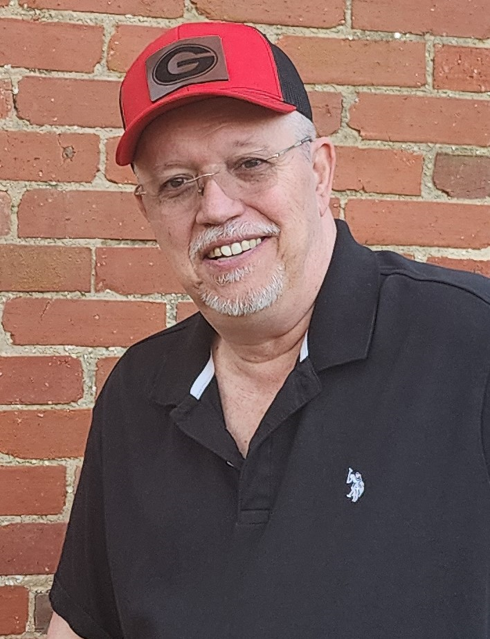 Barry C. Laminack wearing a Georgia Bulldogs cap